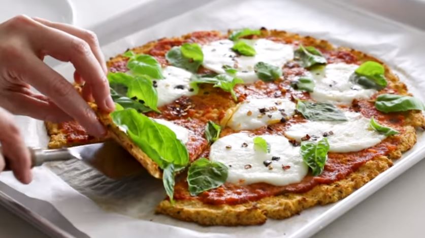After you try this delicious and easy keto cauliflower pizza crust you will look at cauliflower with new eyes! Check out this super easy recipe!